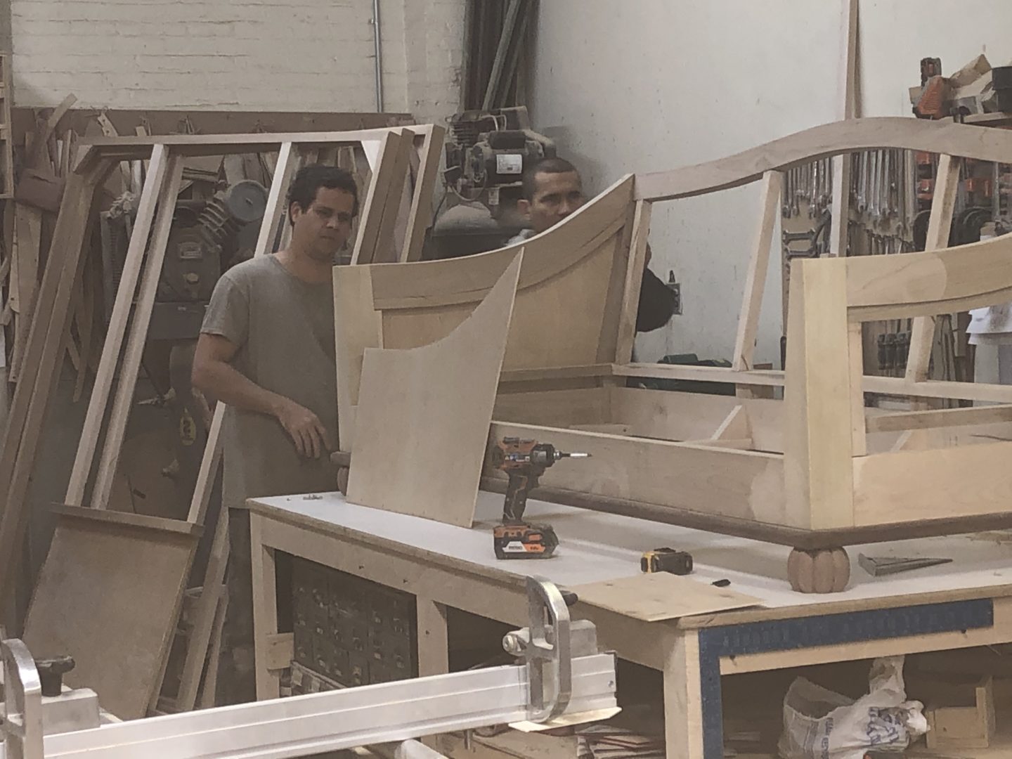 A man working with plywood